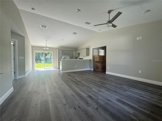 unfurnished living room with dark wood-type flooring, ceiling fan, and lofted ceiling