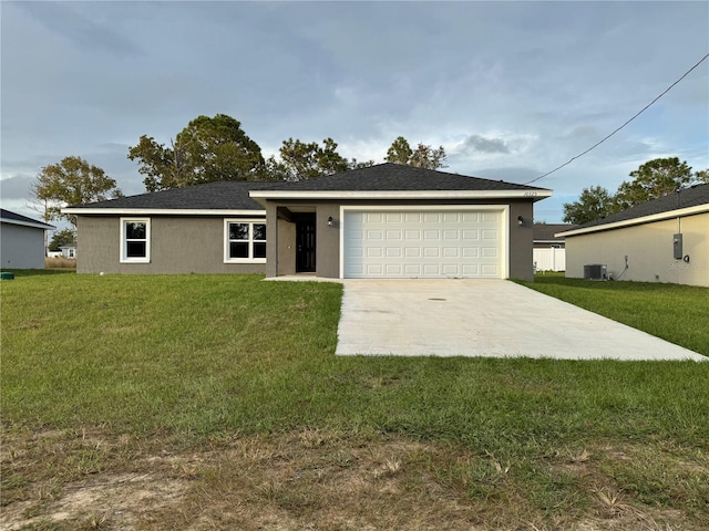 ranch-style home with a garage, central air condition unit, and a front lawn