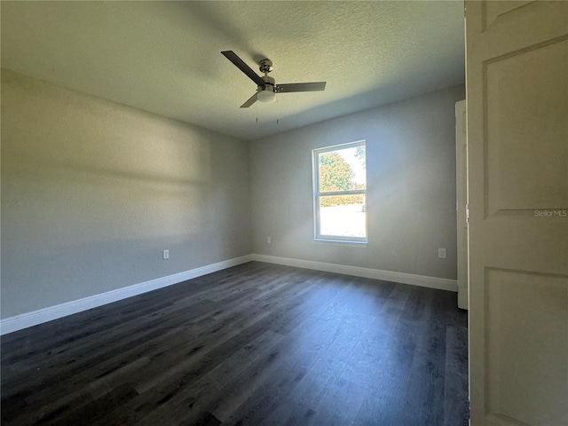 unfurnished room featuring ceiling fan, a textured ceiling, and dark hardwood / wood-style flooring