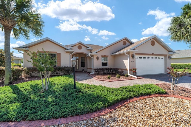 ranch-style home featuring a garage