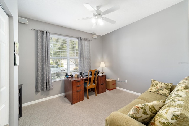 carpeted office featuring ceiling fan