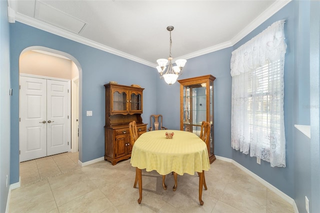 tiled dining room featuring a chandelier and ornamental molding