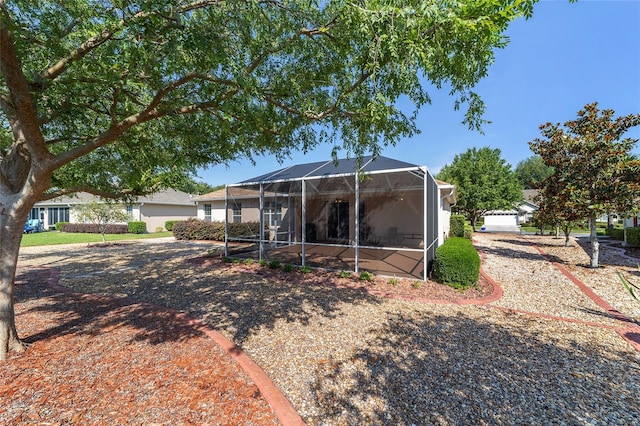 back of property with glass enclosure