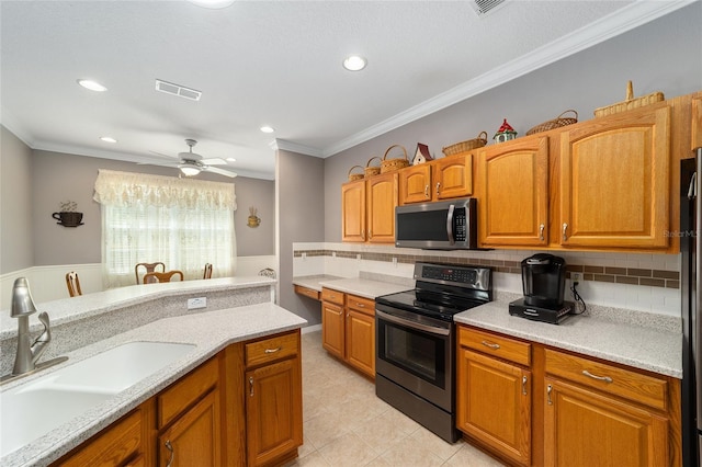 kitchen featuring backsplash, sink, light tile floors, range with electric cooktop, and ceiling fan