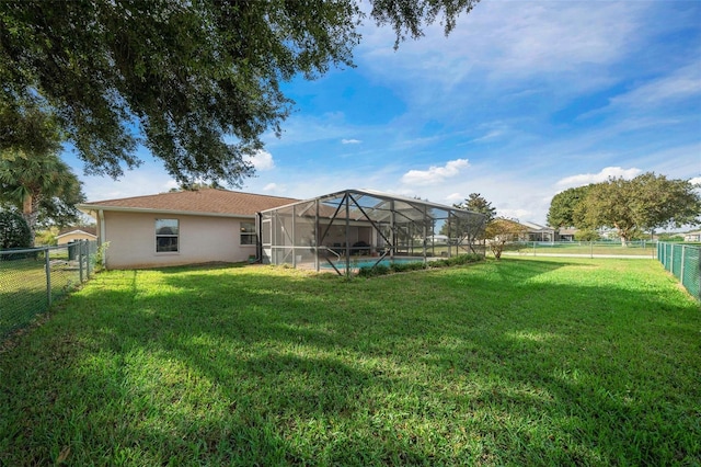 view of yard featuring a lanai