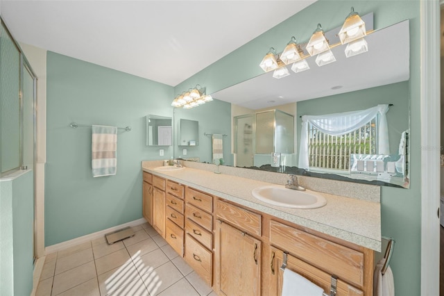 bathroom featuring tile patterned flooring, vanity, and walk in shower