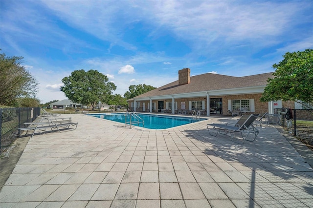 view of pool featuring a patio