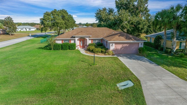 single story home featuring a front yard and a garage