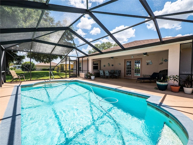 view of pool featuring a lanai, french doors, and a patio