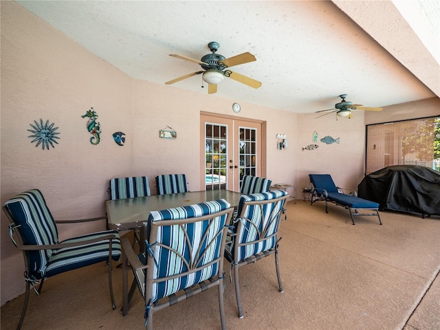 view of patio featuring a grill, ceiling fan, and french doors