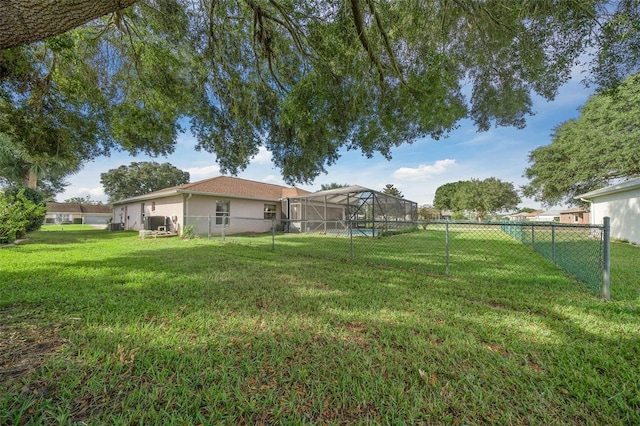 view of yard with a lanai