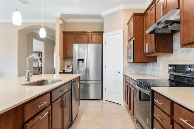 kitchen with backsplash, stainless steel appliances, wall chimney exhaust hood, sink, and light tile floors