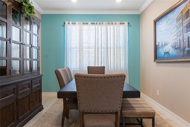 dining space with ornamental molding and plenty of natural light