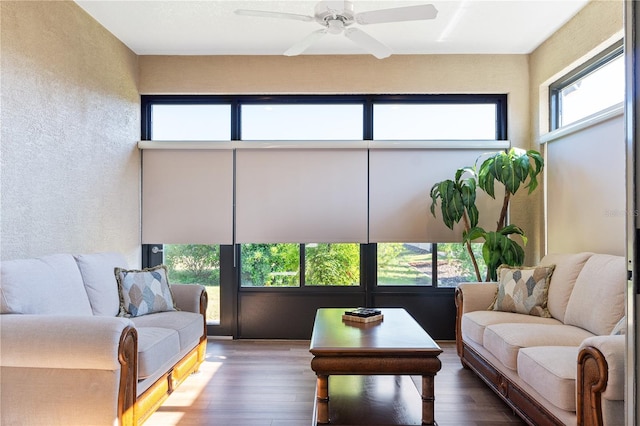 sunroom / solarium featuring ceiling fan