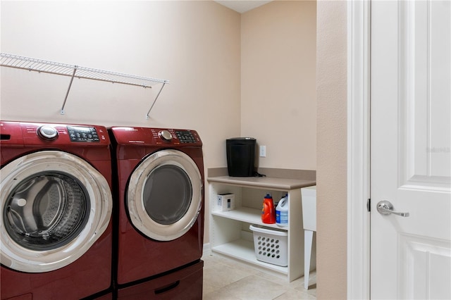 laundry area with separate washer and dryer and light tile floors