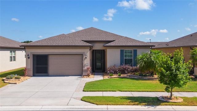 view of front facade with a garage and a front lawn