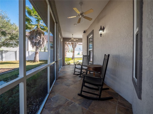 sunroom with ceiling fan