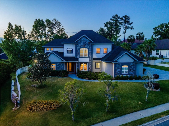 view of front of property with a lawn