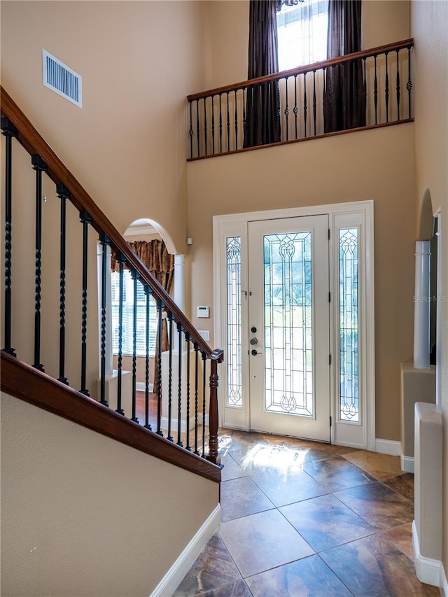 entrance foyer with a towering ceiling