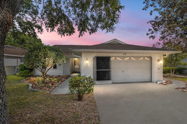 ranch-style home with a garage