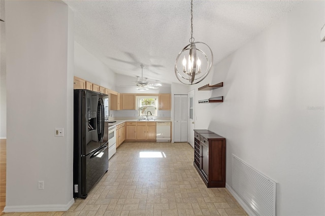 kitchen featuring hanging light fixtures, white appliances, ceiling fan with notable chandelier, light brown cabinetry, and sink