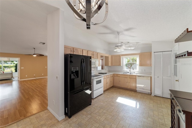 kitchen with light brown cabinetry, white appliances, ceiling fan, and light tile flooring