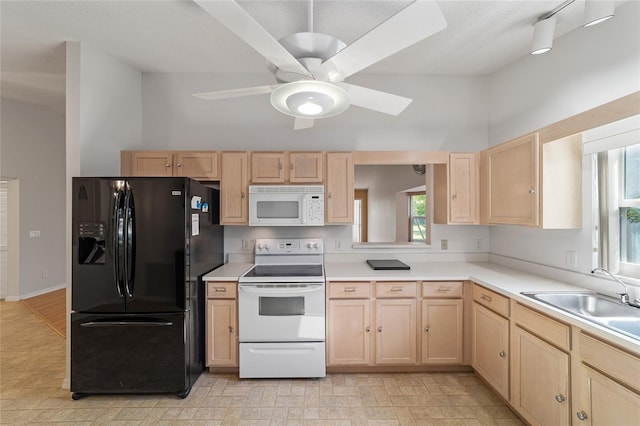 kitchen featuring light brown cabinets, white appliances, ceiling fan, sink, and light tile floors