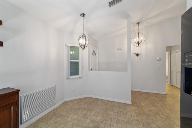 empty room with an inviting chandelier