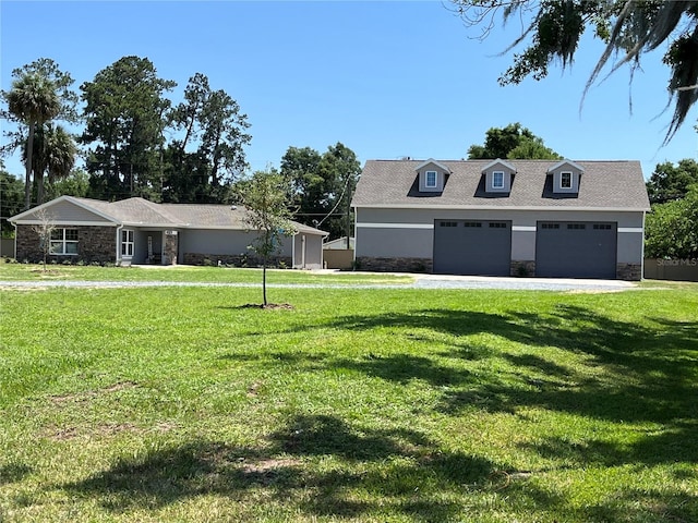 view of front of house with a front lawn and a garage