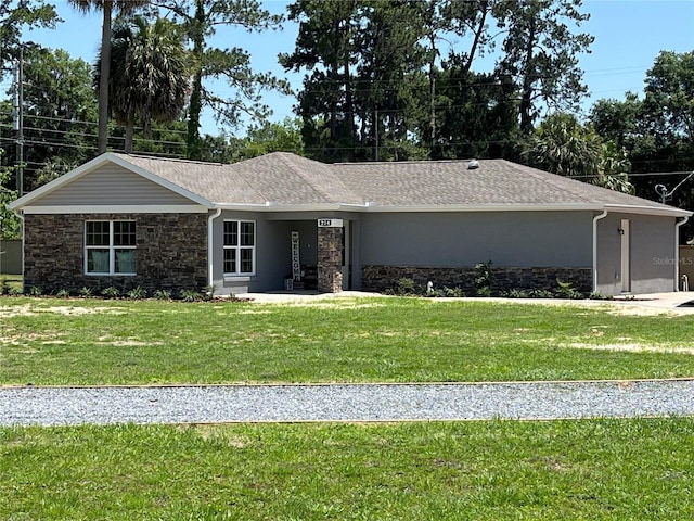 ranch-style home with a front yard