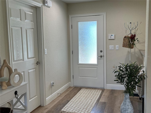 doorway to outside featuring hardwood / wood-style flooring