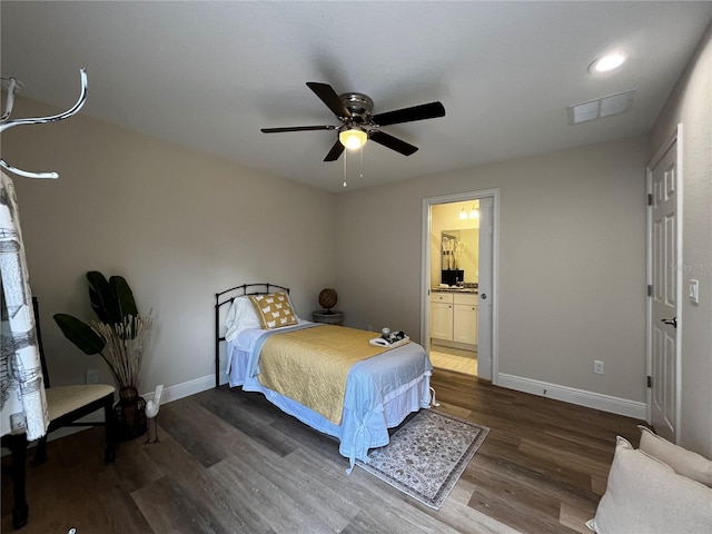 bedroom featuring ensuite bathroom, ceiling fan, and dark hardwood / wood-style floors