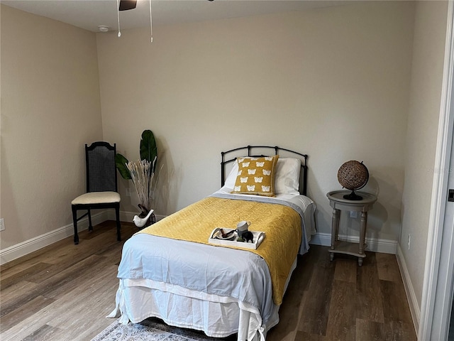 bedroom with hardwood / wood-style floors and ceiling fan