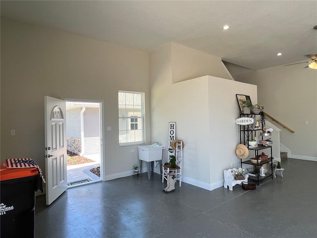 interior space featuring ceiling fan