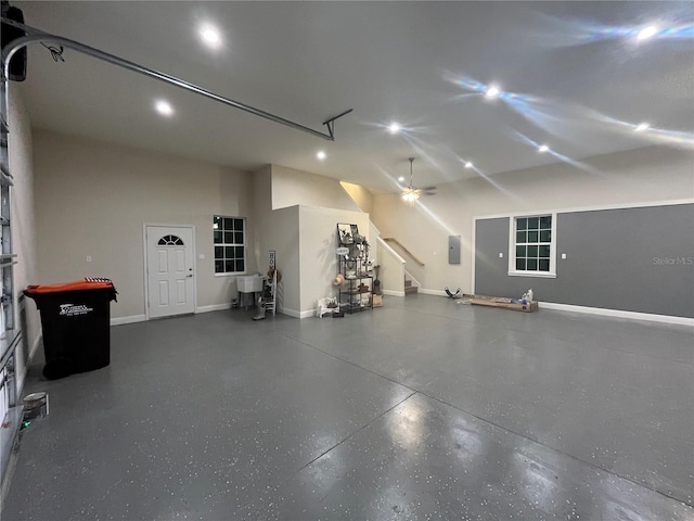 garage with ceiling fan and electric panel