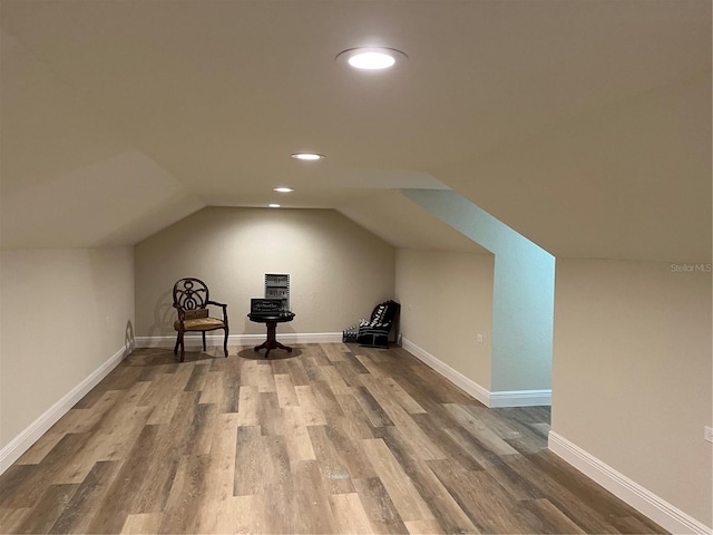 bonus room featuring lofted ceiling and hardwood / wood-style floors