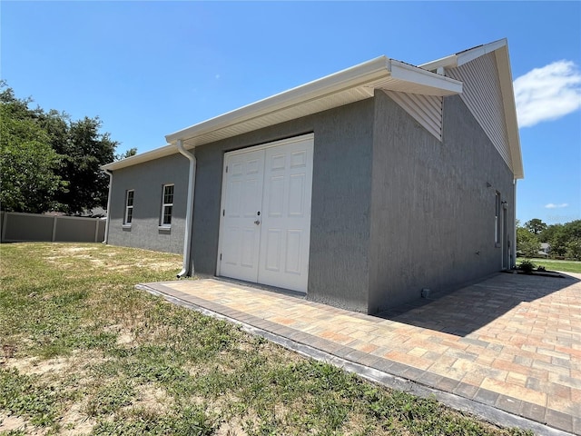 view of outbuilding with a yard