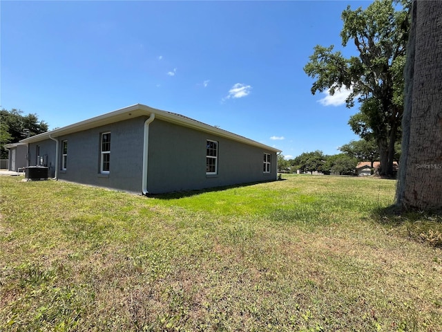 view of home's exterior featuring a lawn and cooling unit