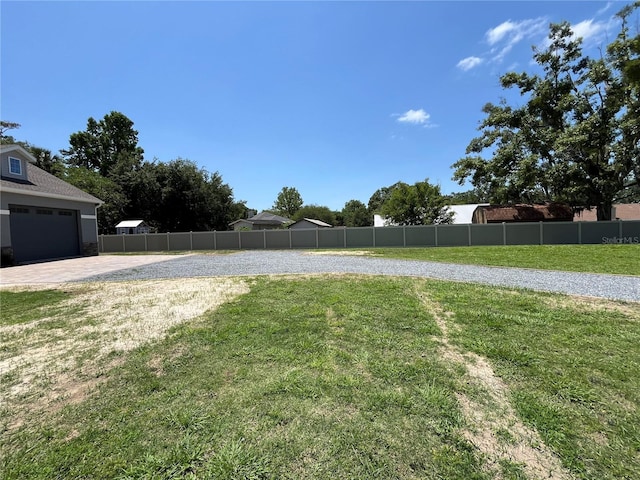 view of yard with a garage