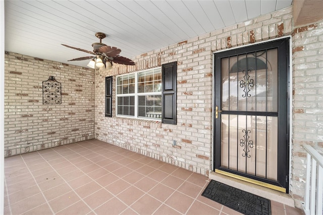 doorway to property featuring ceiling fan and covered porch