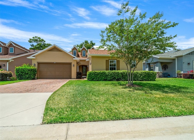 view of front of property featuring a garage and a front lawn