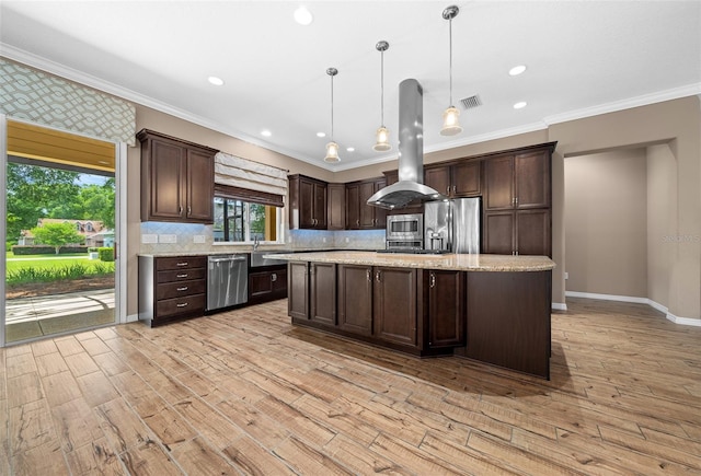 kitchen featuring light hardwood / wood-style flooring, decorative light fixtures, island range hood, dark brown cabinetry, and stainless steel appliances