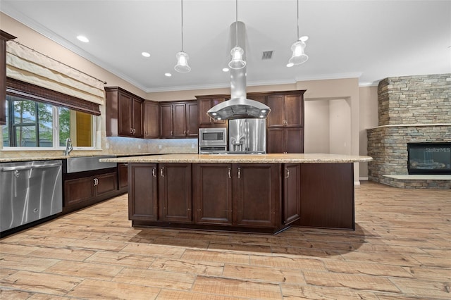 3396 NW 55th Ct, Ocala, FL 34482 - kitchen featuring stainless steel appliances, ornamental molding, dark brown cabinetry, light wood-style floors, and backsplash