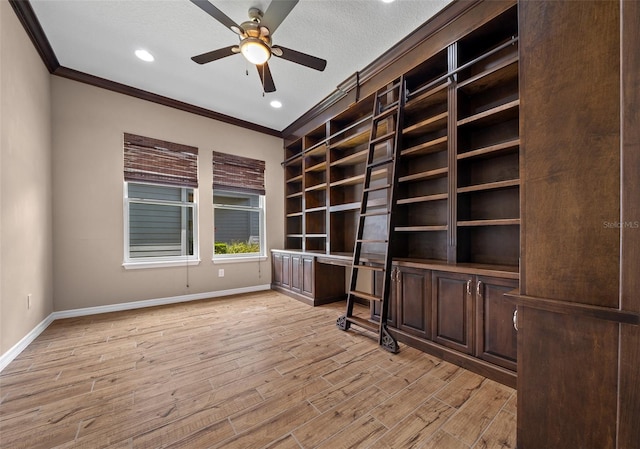 unfurnished office with a textured ceiling, light hardwood / wood-style flooring, and crown molding