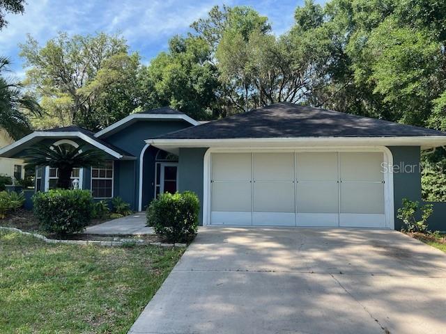 ranch-style home with a garage