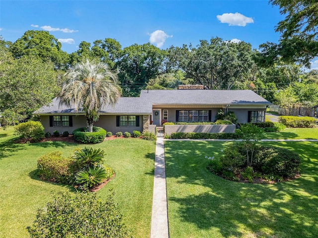 single story home with a front yard