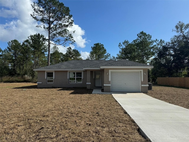 ranch-style home featuring a garage