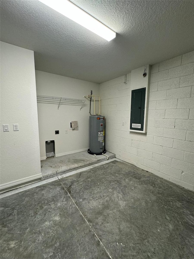 laundry room featuring a textured ceiling, electric panel, and water heater