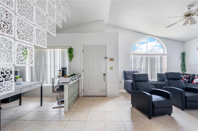 tiled entrance foyer with lofted ceiling and ceiling fan