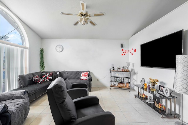 tiled living room featuring ceiling fan